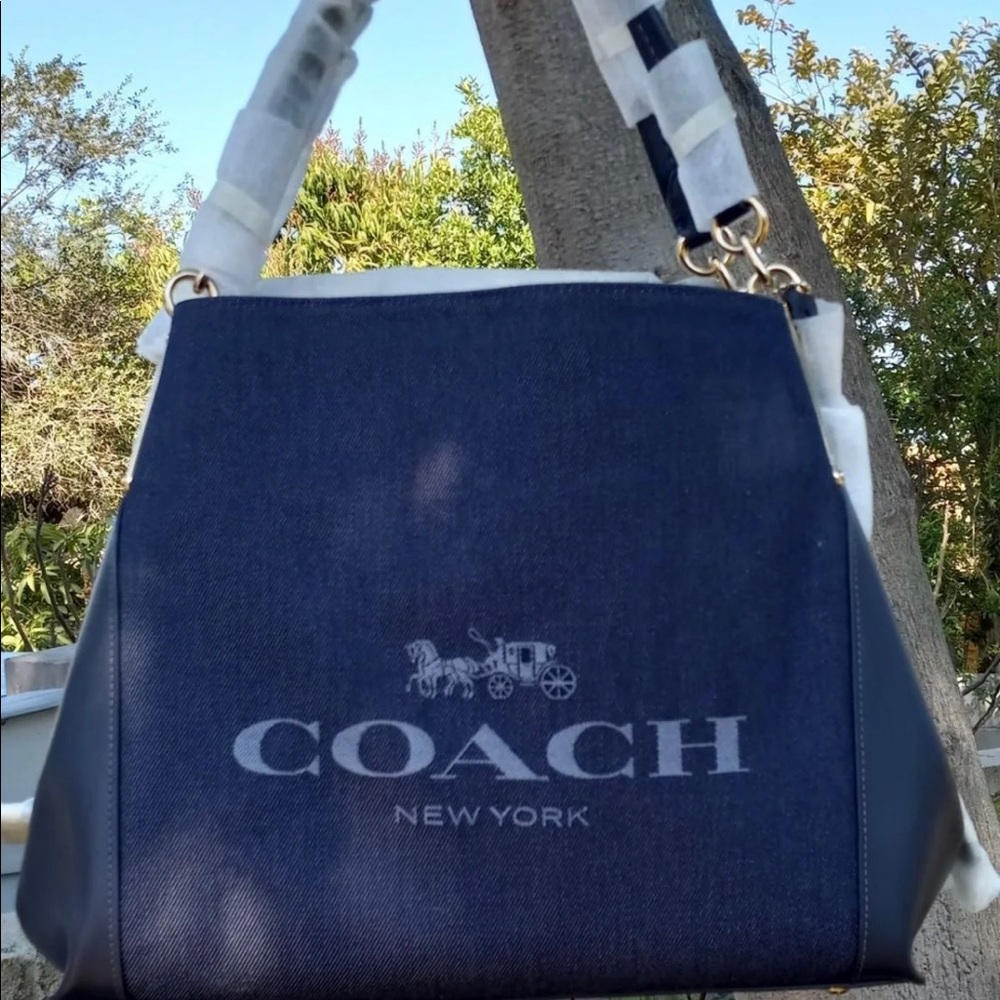 Absolutely gorgeous denim and leather Coach shoulder bag with gold hardware.